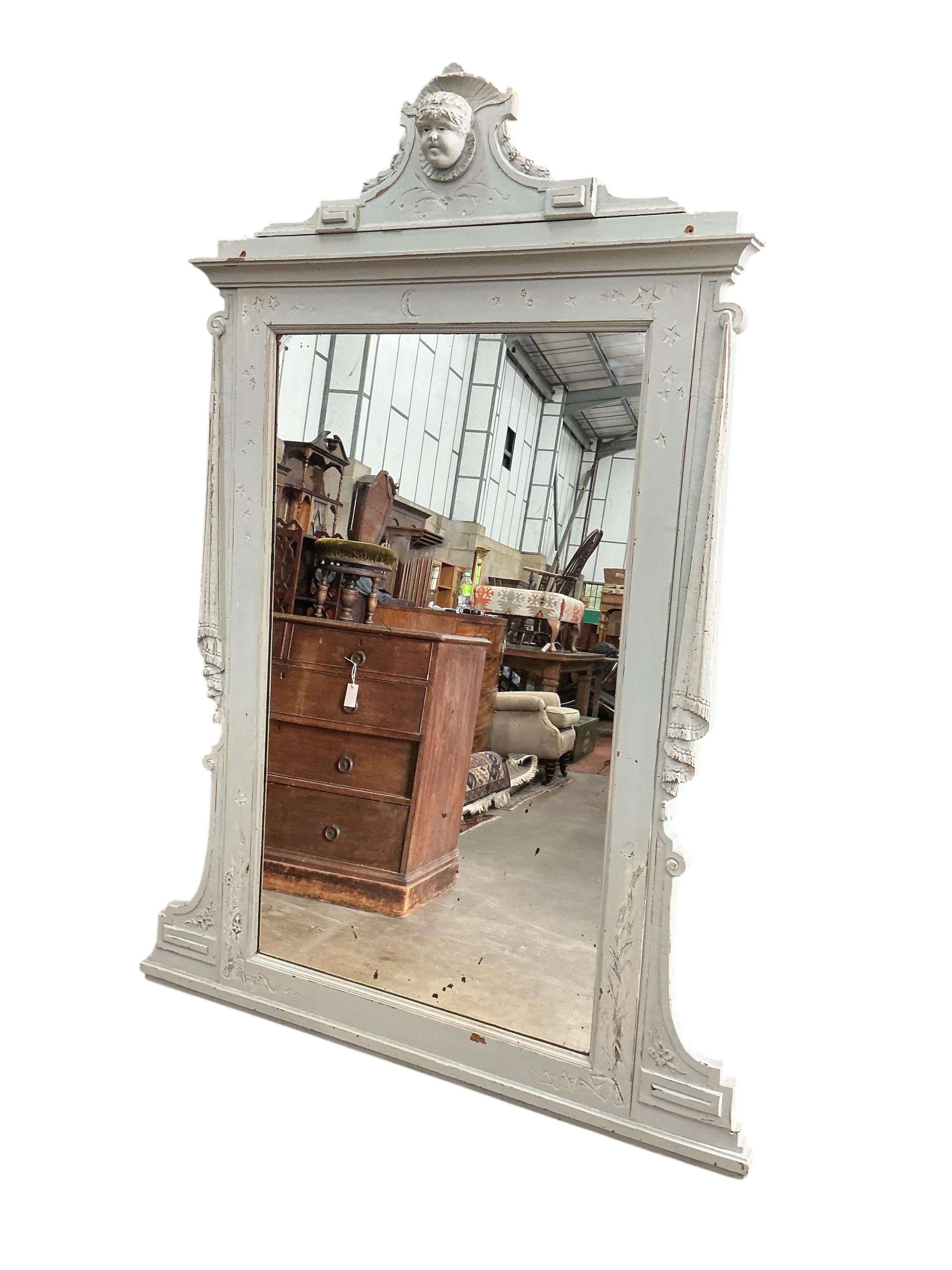 A 19th century Sicillian painted overmantel mirror, with cherub's head pediment, width 136cm, height 184cm